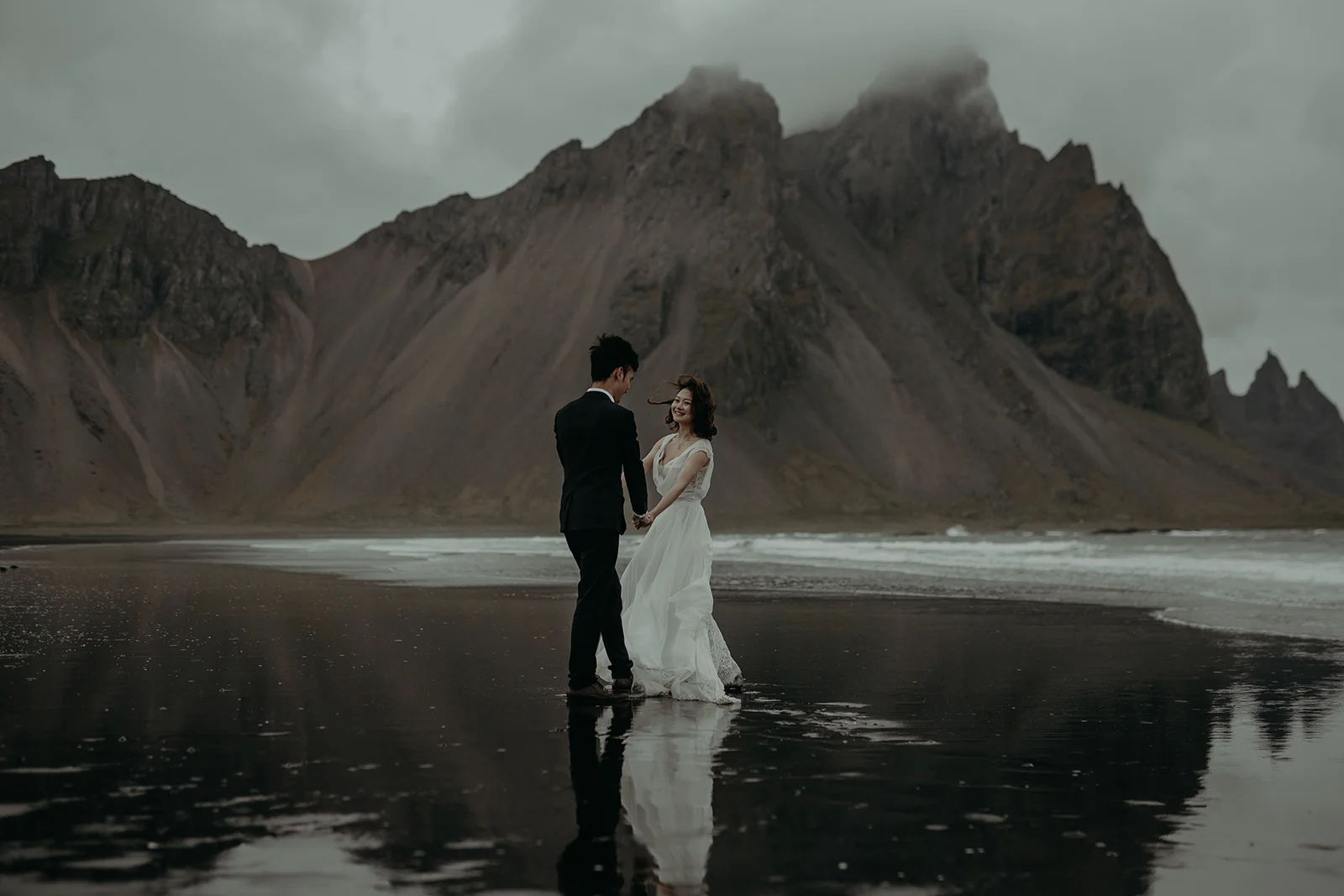 Vestrahorn elopement photograph of the couple with the mountain at the background