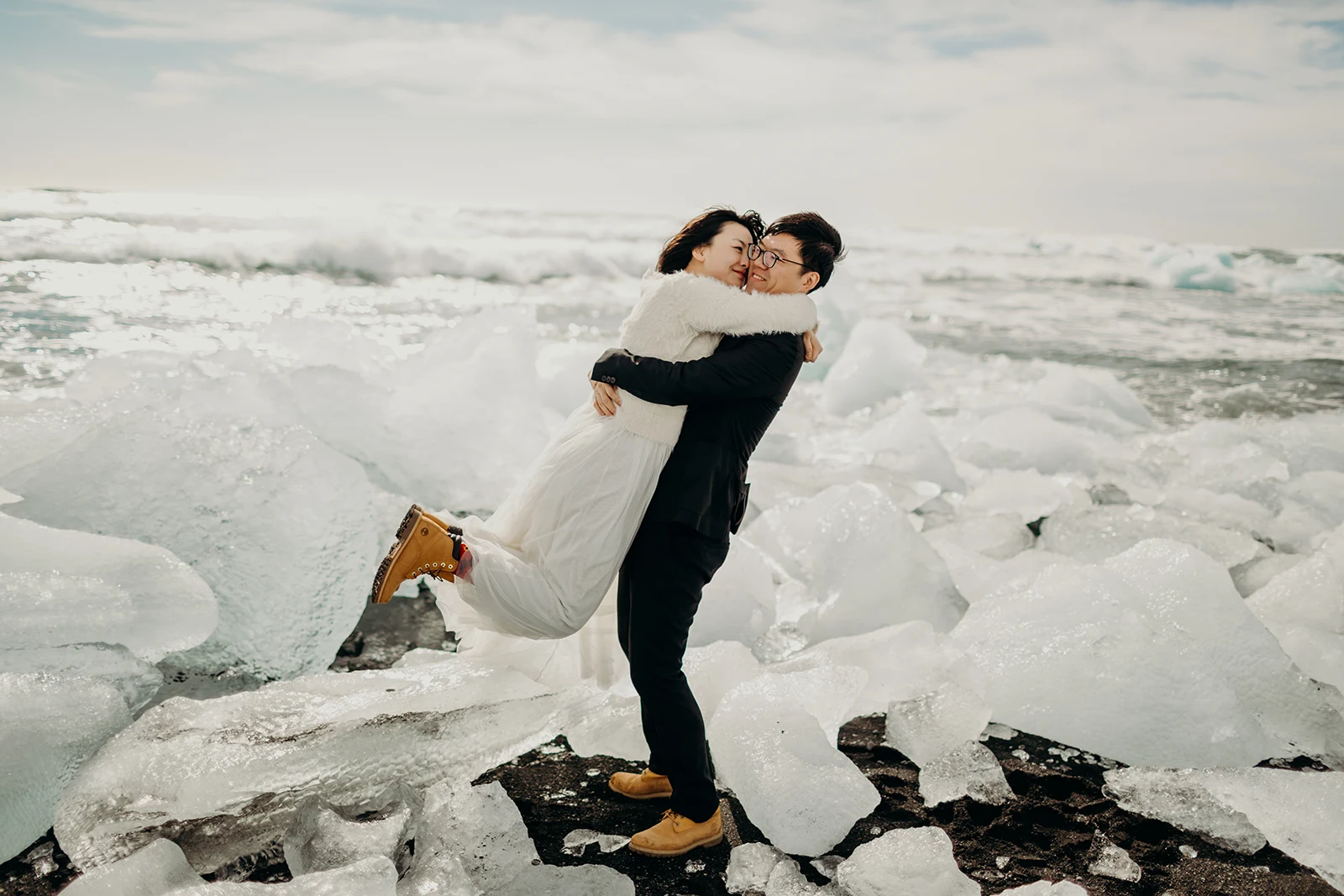 Diamond Beach elopement photograph of the couple standing on the iceberg